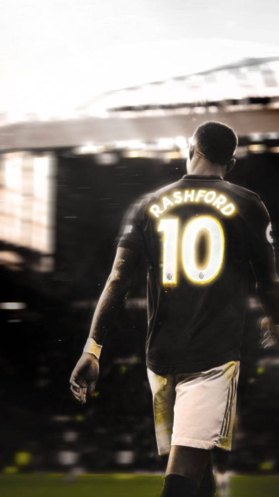 Marcus Rashford Manchester United number 10 walking on pitch greyscale stadium background yellow name Wallpaper