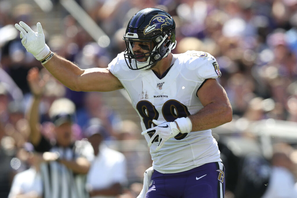 Mark Andrews Baltimore Ravens celebrating on field dynamic football game wallpaper background