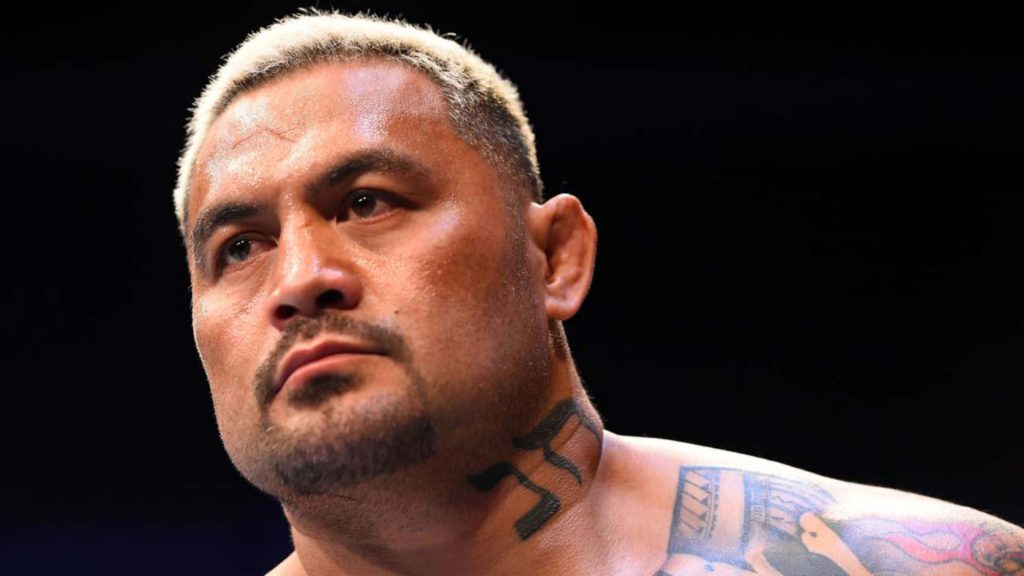 Close-up portrait of MMA legend Mark Hunt with bleached hair tribal tattoo intense stare Wallpaper
