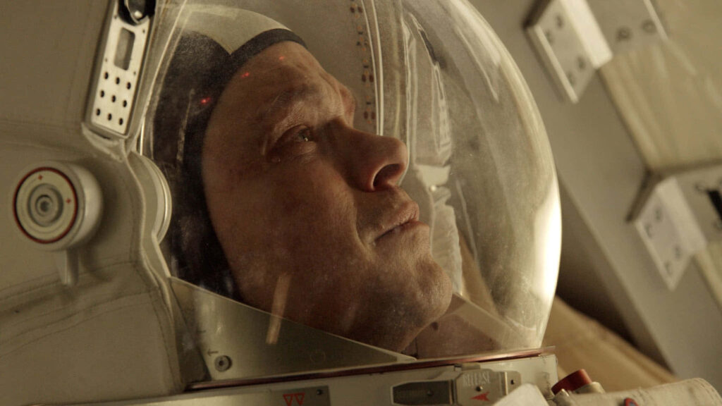 Mark Watney in astronaut suit reflecting inside helmet facing Mars isolation wallpaper background