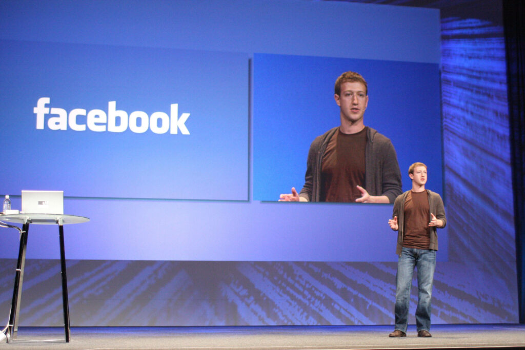 Mark Zuckerberg Presentation on Stage: Tech-Inspired Wallpaper Background