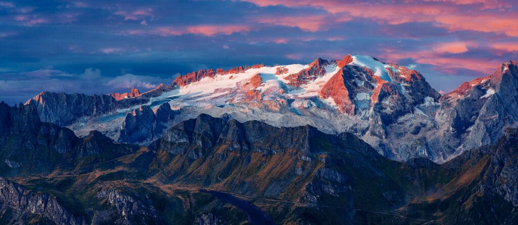 Marmolada Glacier sunset with pink blue hues rugged snowy peaks alpine landscape Italy wallpaper