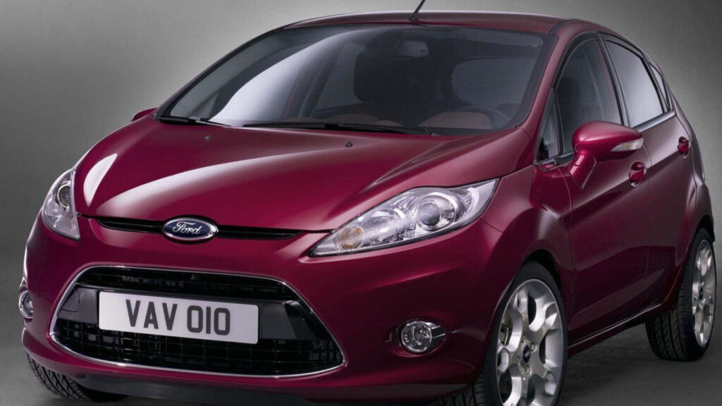 Maroon Ford Fiesta car wallpaper showcasing modern design and sporty appeal on neutral background
