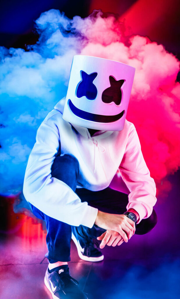 Colorful Clouds Surround Famous American DJ Marshmello's Lively Performance - Catchy Wallpaper for your iPhone!