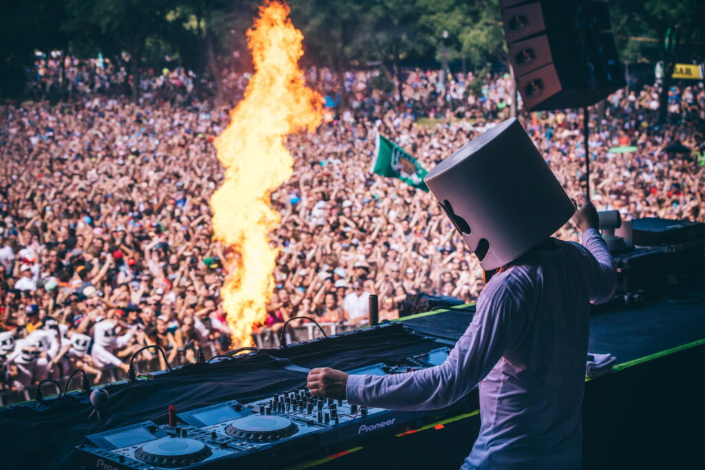 Marshmello DJ live concert 4K wallpaper vibrant pyrotechnics Pioneer console festival crowd