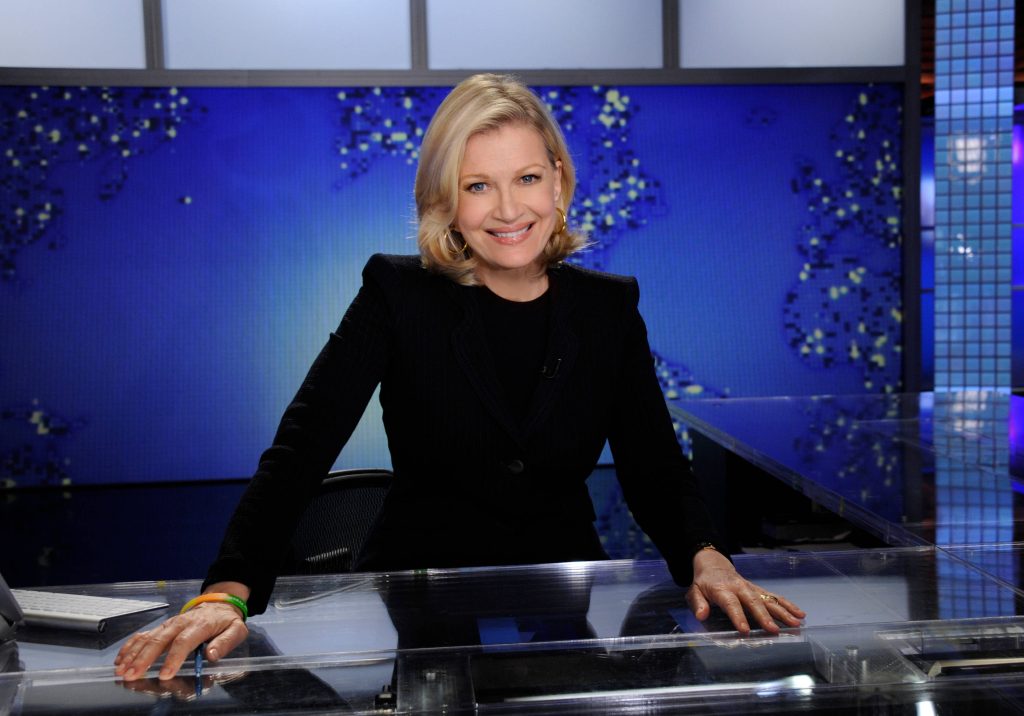 Fox News anchor Martha MacCallum in black blazer at news desk with vibrant blue broadcast background Wallpaper