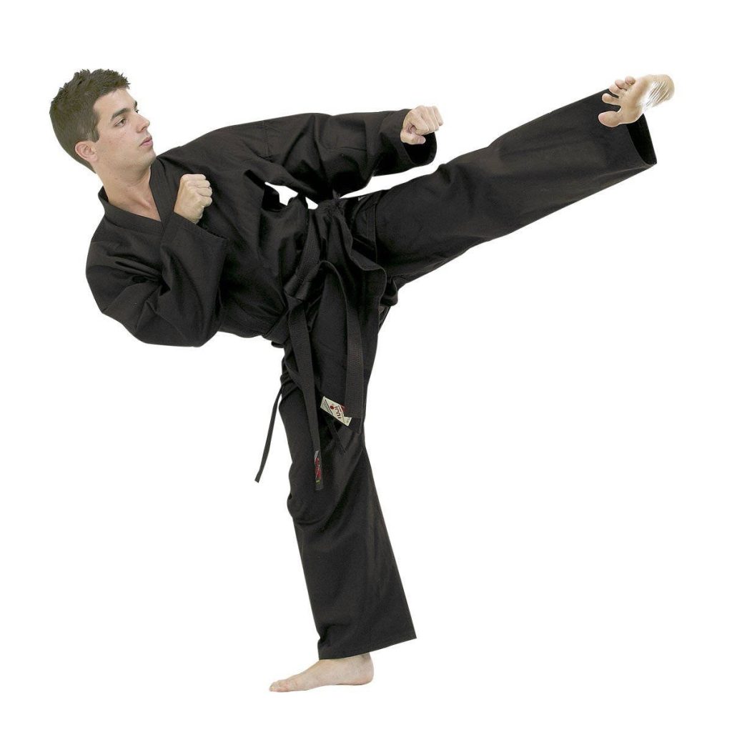 Male martial artist in black uniform executing a strong side kick isolated on white background Wallpaper