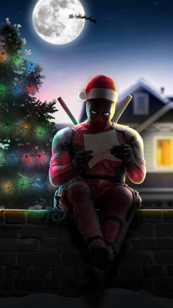 Marvel Magic: Superhero in Santa Hat on Rooftop with Christmas Tree Wallpaper