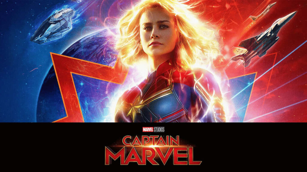 Captain Marvel Soars Amidst Celestial Marvel Studios Backdrop Wallpaper