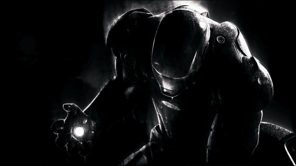 Iron Man Unleashing Electrifying Power against a Striking Black Background Wallpaper