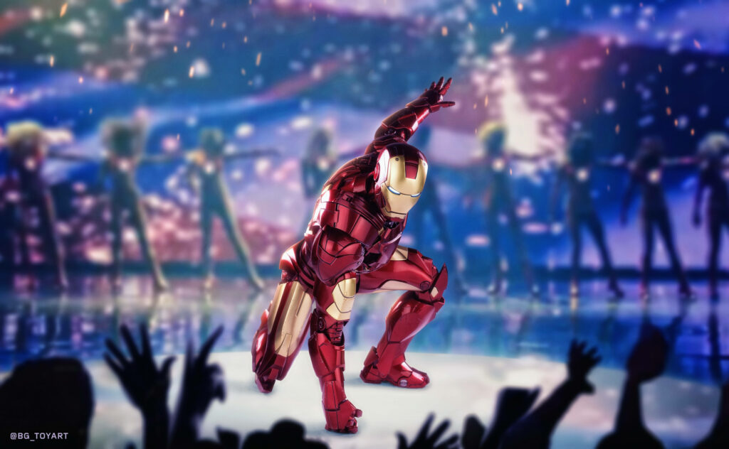Red Suited Icon: Iron Man Takes Center Stage with Dancers, Captivating Cheering Onlookers in a Spectacular Display Wallpaper