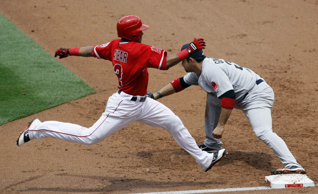 Boston Red Sox Marwin Gonzalez making a key defensive play at first base in baseball game wallpaper