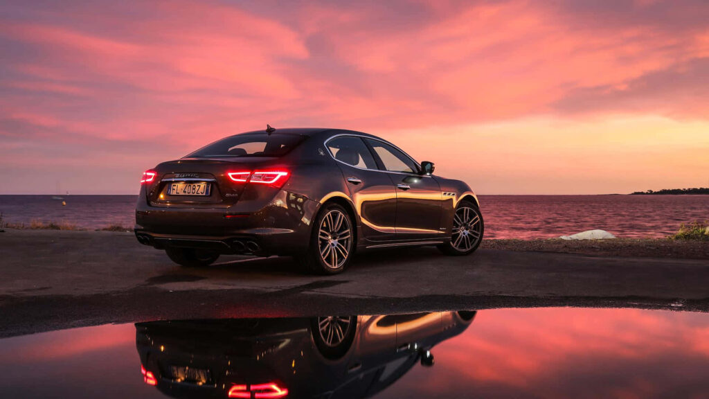 Maserati Ghibli Wallpaper: Luxury Sedan at Sunset Background