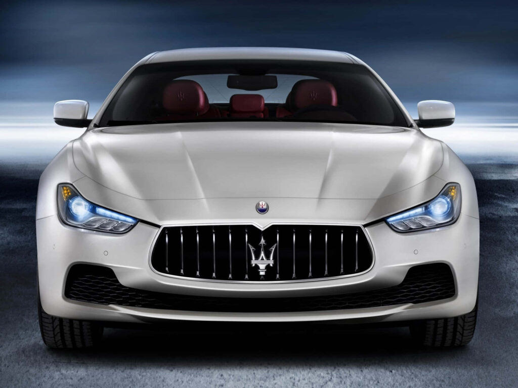 Maserati Ghibli Wallpaper: Sleek Design & Iconic Grille in Modern Setting