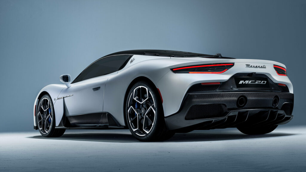 Maserati MC20 rear view showcasing aerodynamic design sharp taillights and alloy wheels Wallpaper