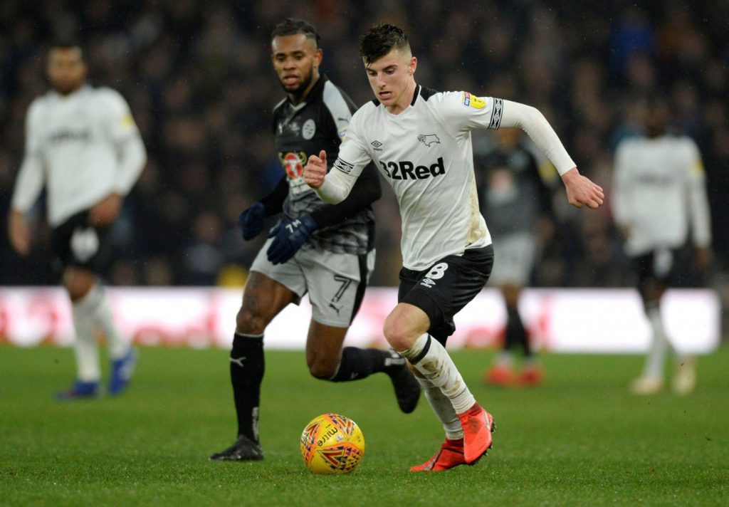Mason Mount Derby County dribbling football on grass pitch action wallpaper background