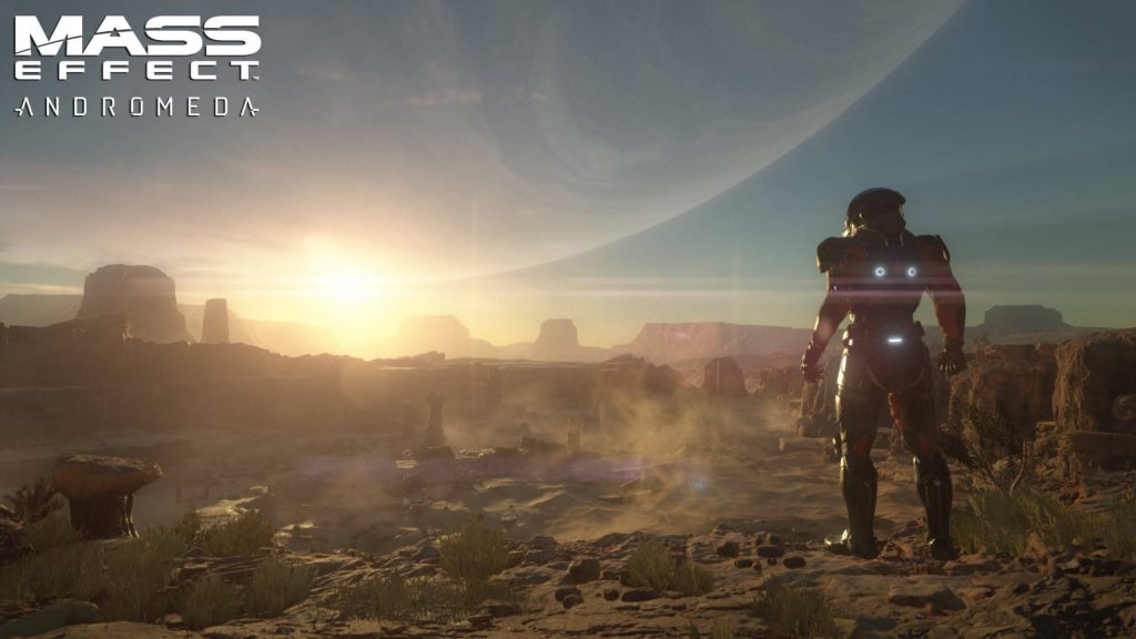 Mass Effect Andromeda Pathfinder in armor on alien desert planet at golden sunset wallpaper background