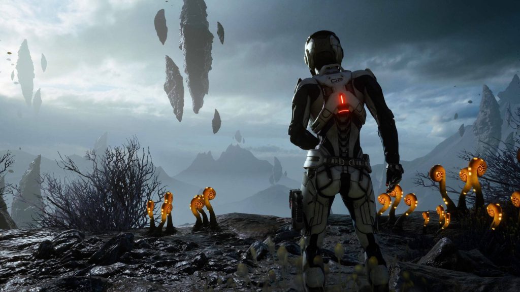 Pathfinder in iconic armor gazing at rugged alien landscape with floating rocks and glowing plants Wallpaper