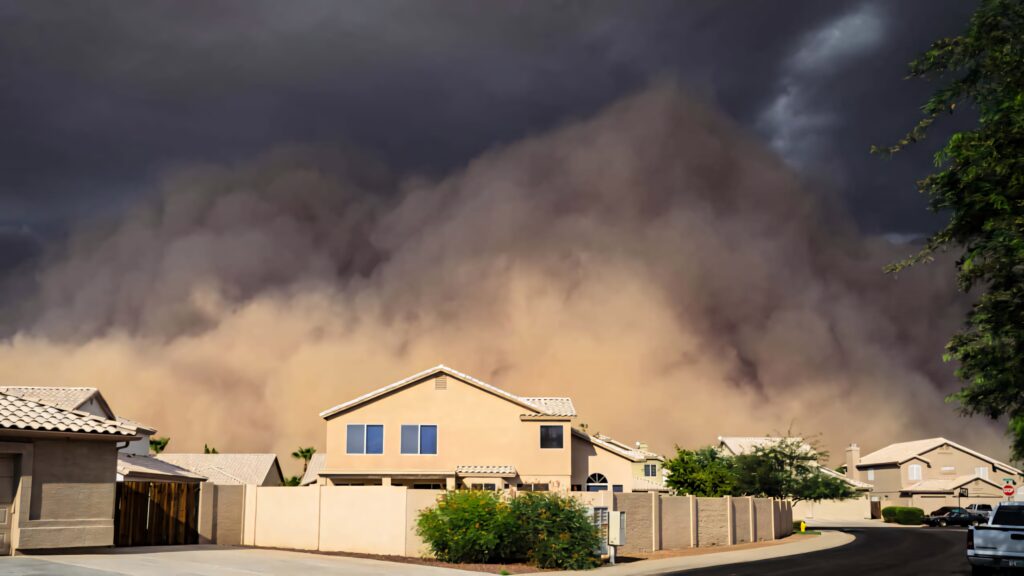 Massive dust storm dark clouds swirl over suburban neighborhood intense nature power wallpaper