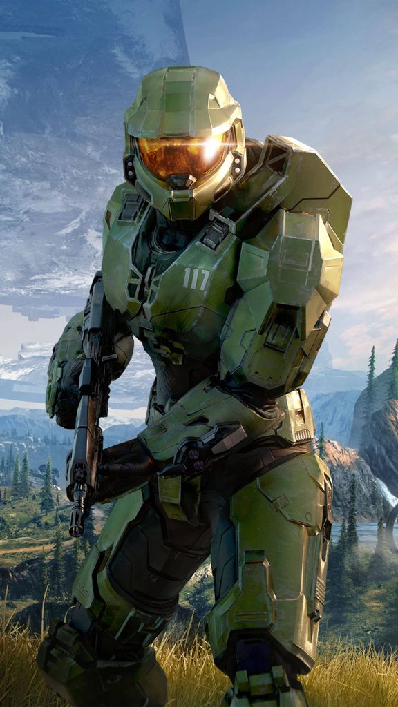 Master Chief in detailed armor with assault rifle on Zeta Halo mountains in Halo Infinite wallpaper