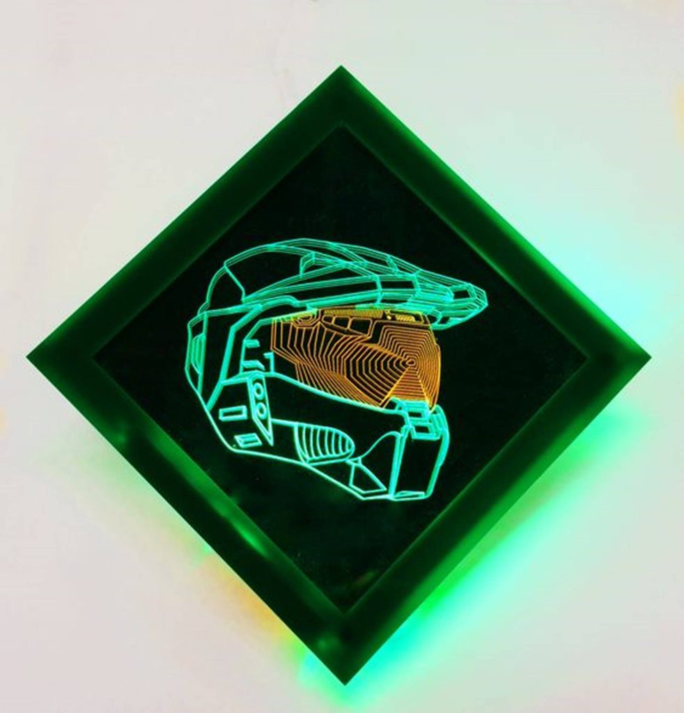 Neon Master Chief helmet wallpaper glowing green with amber visor diamond LED art background