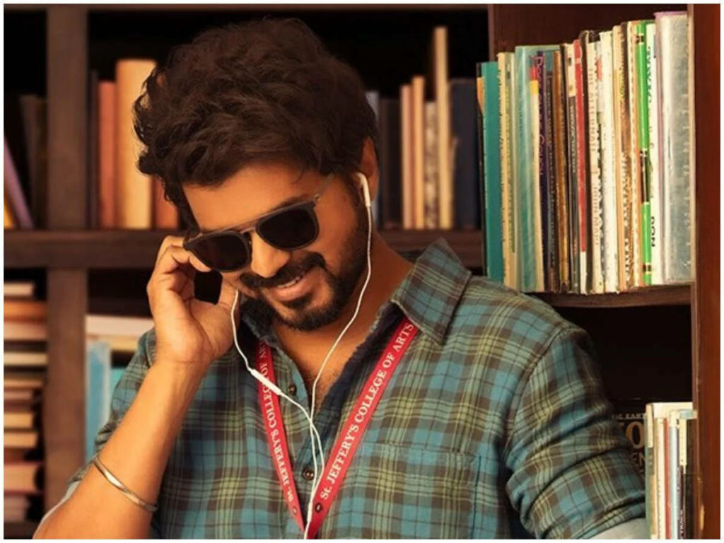 Master Vijay Immersed in Music as He Enjoys Some Quiet Time in the Library Wallpaper