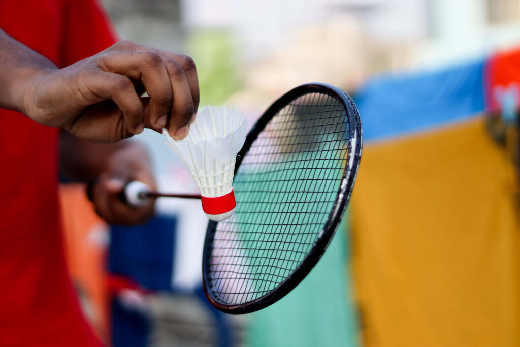 Badminton Display: Masterful Players Showcase Perfect Skills Wallpaper
