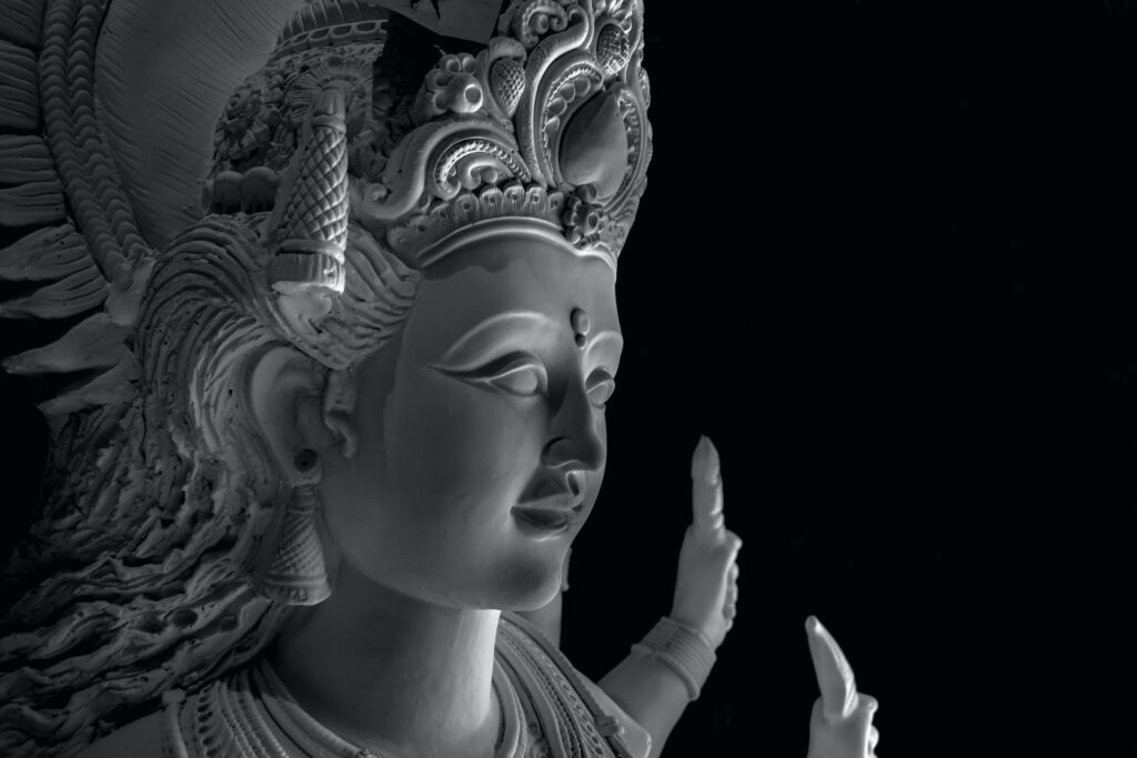 Ethereal Beauty: A Captivating Portrait of Mata Rani in a Mysterious Black Setting Wallpaper