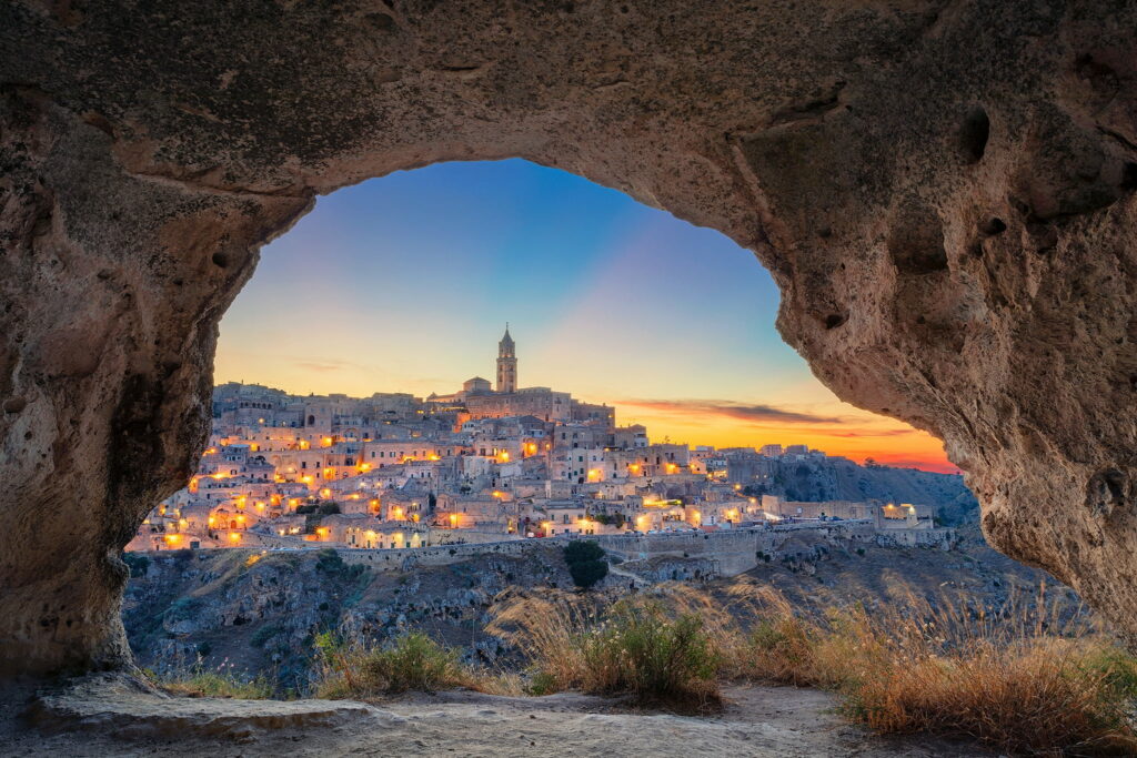 Enchanting Matera: A Captivating Cave Town Nestled Amidst Italy's Serene Gray Concrete Buildings Wallpaper
