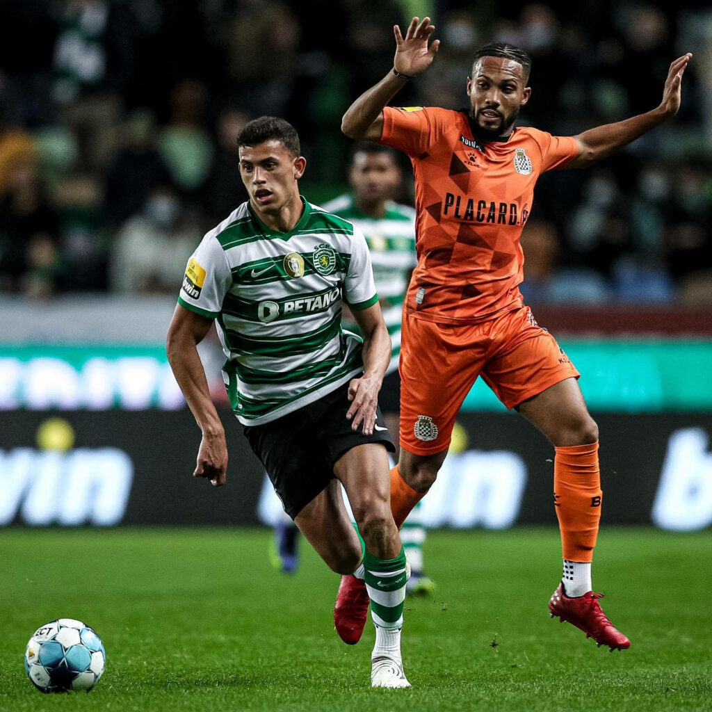 Matheus Nunes, the relentless footballer, chasing down the ball with determination - A thrilling moment captured! Wallpaper