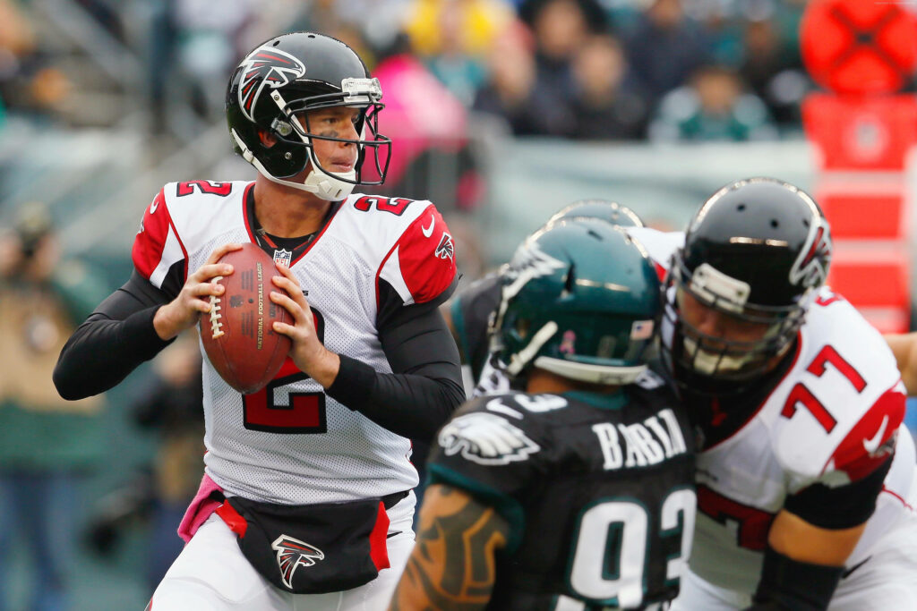 Atlanta Falcons quarterback Matt Ryan focused preparing to throw pass during football game action Wallpaper