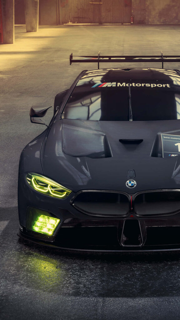 4K Beauty: Matte Black BMW M8 Model Car Shining in HD Mobile Wallpaper