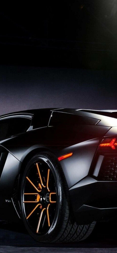 Matte black Lamborghini rear with orange rims on dark background iPhone Lamborghini wallpaper