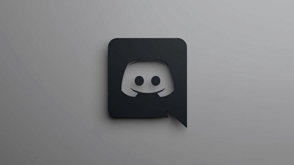Minimalist matte black Discord logo with 3D shading on smooth grey gradient wallpaper background