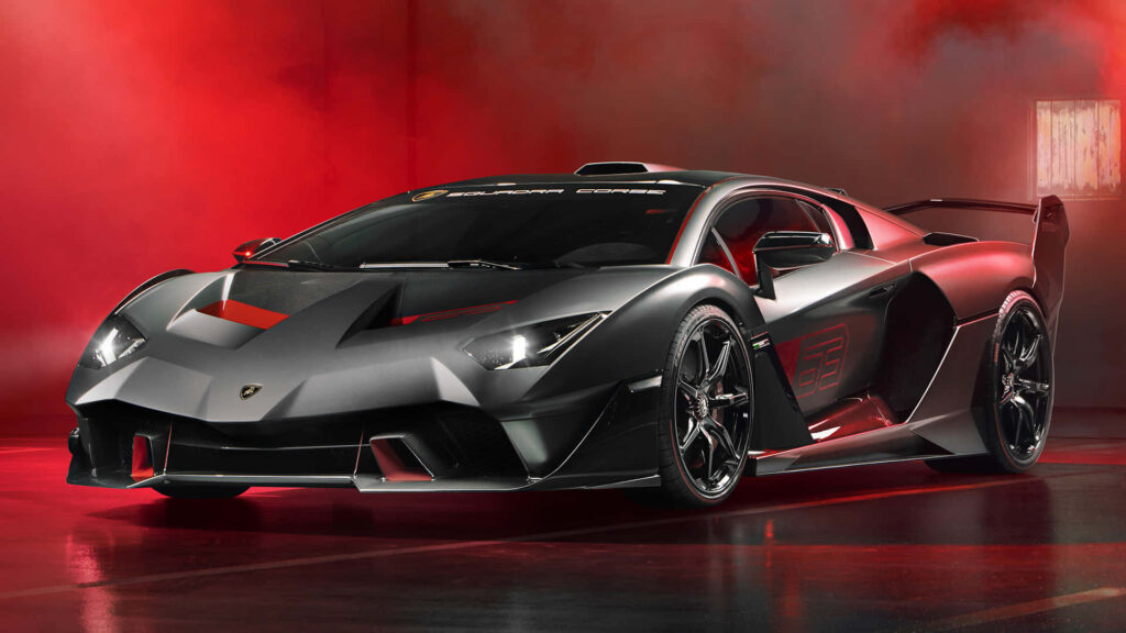Matte black sports car with aggressive design on bold red background dynamic wallpaper