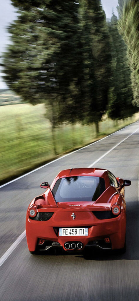 Roaring Elegance: Capturing the Spirit of a 2015 Ferrari 458 Spider in Max Ferrari's Scenic Backdrop Wallpaper