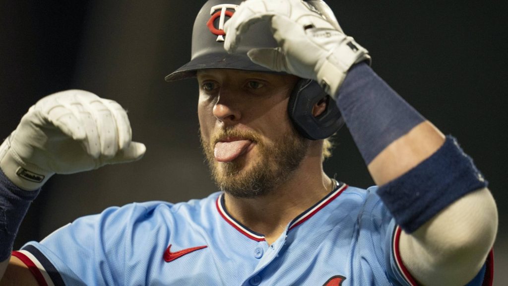 Minnesota Twins Max Kepler in light blue jersey with batting helmet playful MLB action wallpaper
