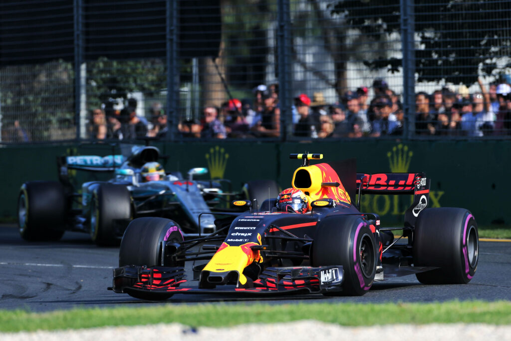 Max Verstappen racing Red Bull car 2016 Australian Grand Prix F1 fans in stands wallpaper