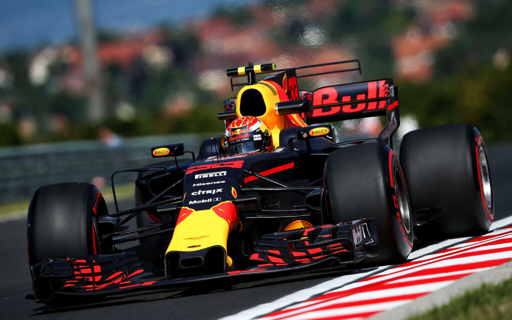 Max Verstappen driving Red Bull Formula 1 car at Bahrain Grand Prix motorsport race action Wallpaper