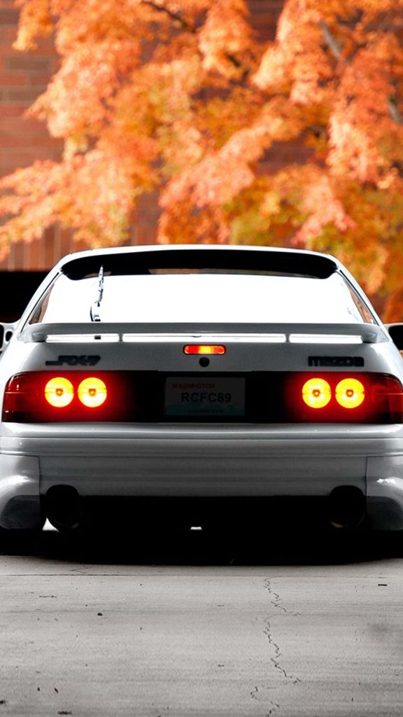 Sharp white Mazda RX7 FC rear view glowing taillights autumn foliage JDM sports car wallpaper