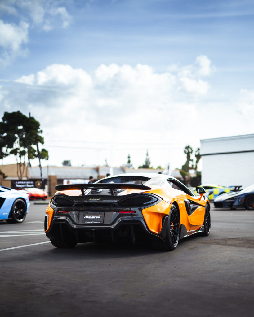 Vibrant Yellow McLaren 600LT: Striking Back View in Parking Area Wallpaper