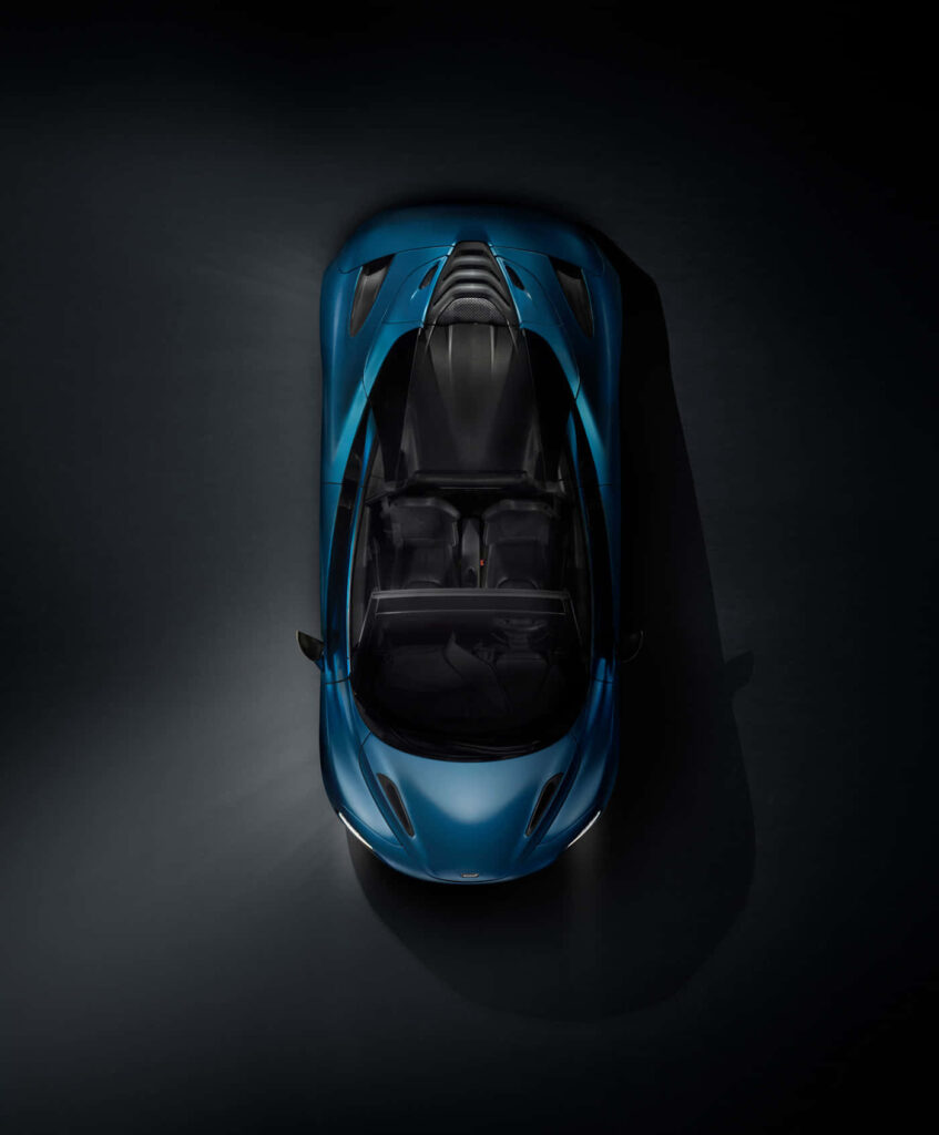 Top view McLaren 720s wallpaper sleek aerodynamic design futuristic car dark background