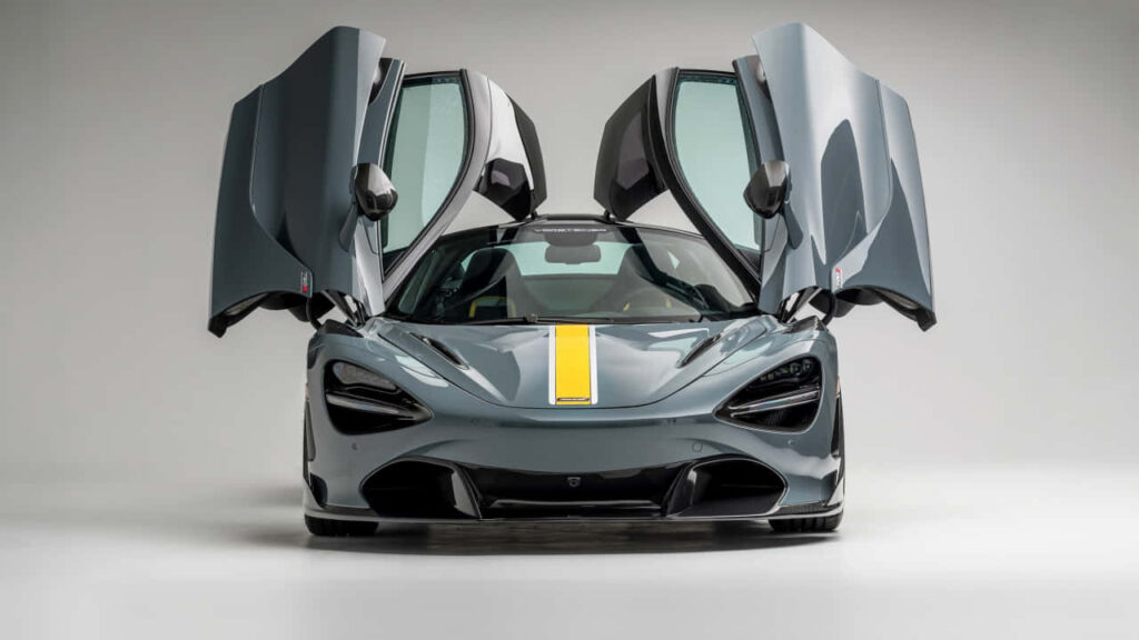 McLaren 720s front view with butterfly doors open showcasing sleek design and dynamic style Wallpaper