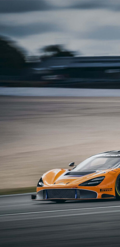 McLaren 720s orange supercar racing on track dynamic wallpaper showcasing sleek design speed