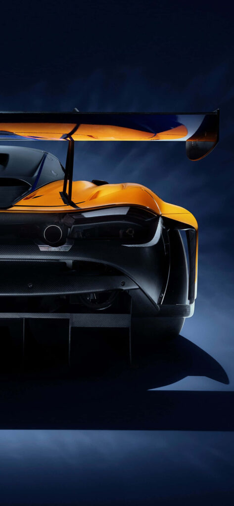 McLaren 720S rear view wallpaper showcasing sleek design bold lines and dramatic background