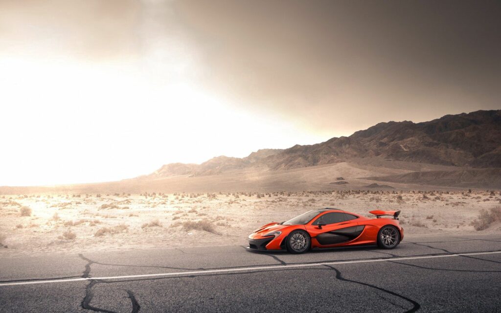 Dynamic McLaren P1 Wallpaper: Orange Luxury on Open Road