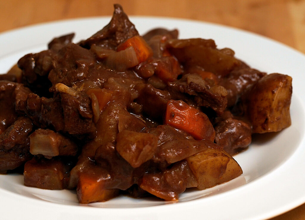 Delicious Beef Bourguignon Wallpaper: Hearty Meal Background