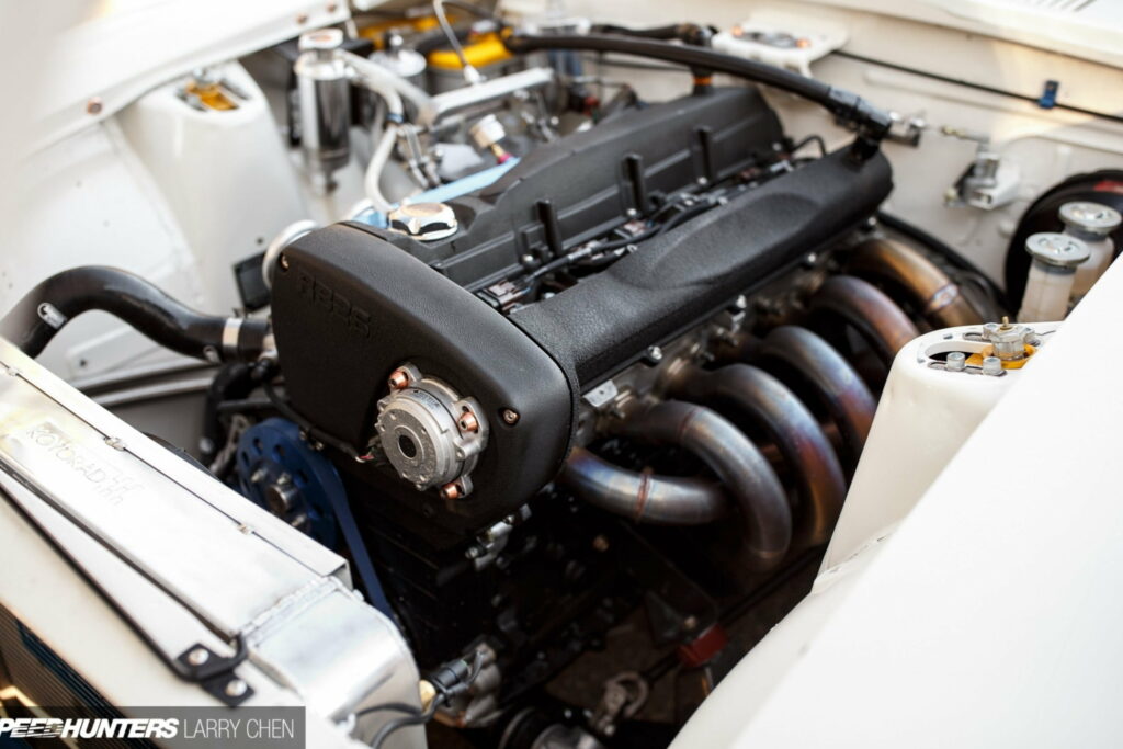 Mechanical Symphony: An Artistic Display of Auto Components in Engine Bay QHD Wallpaper Background