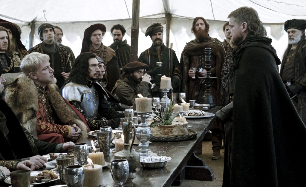 Medieval Drama: Intense Dinner Scene from The Last Duel Wallpaper