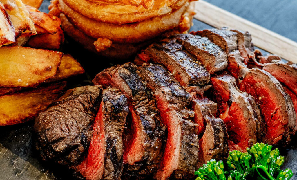 Medium-Rare Steak Grilled to Perfection - Mouthwatering Wallpaper